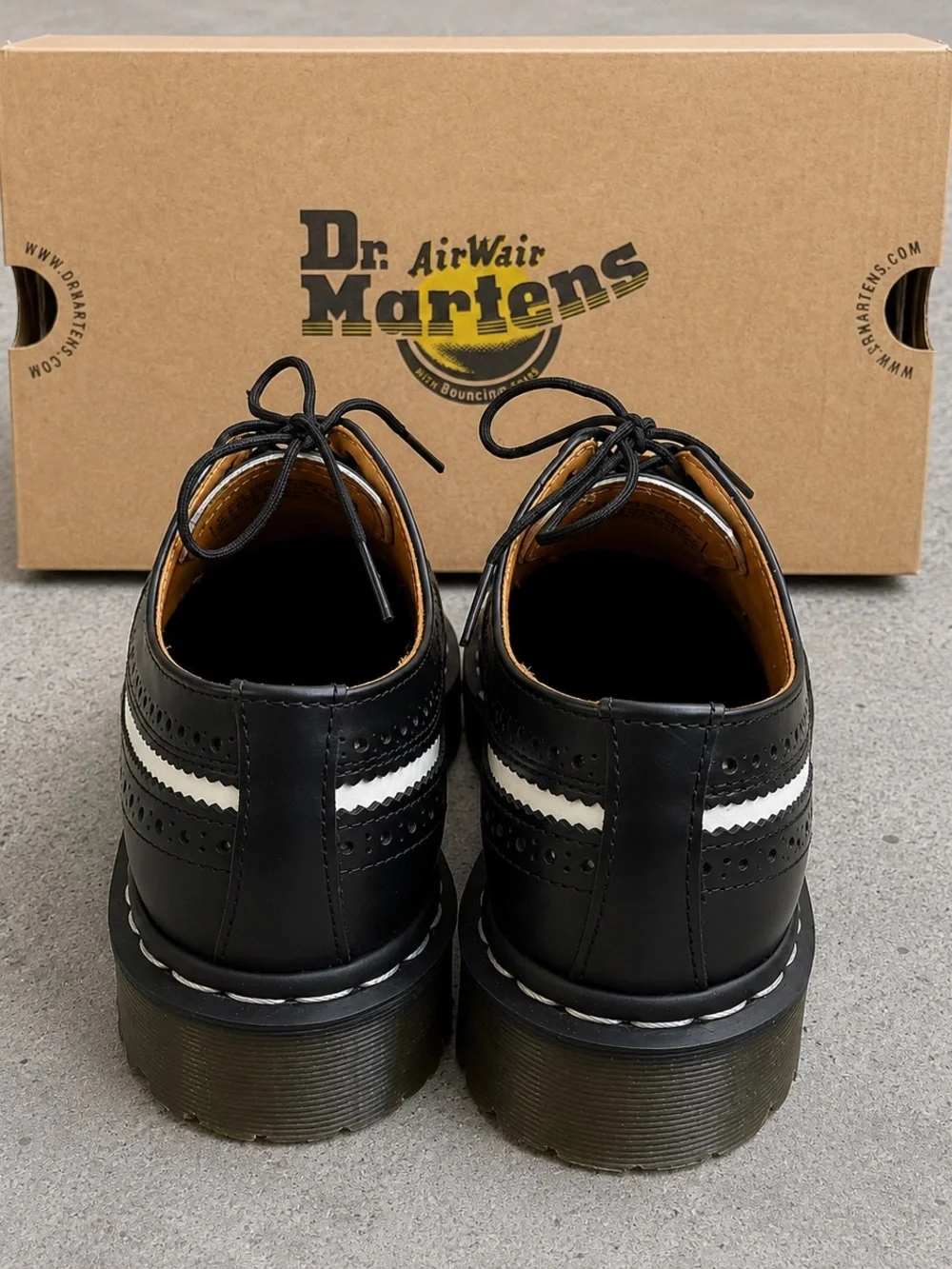 Dr. Martens Black & White Brogue Saddle Oxfords